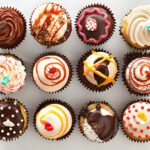 Easy cupcake recipes – assorted vanilla and chocolate frosted cupcakes on a rustic wooden table